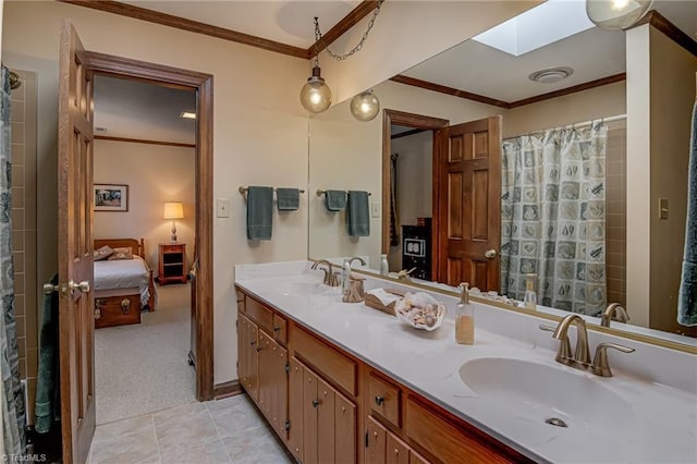 full bath featuring connected bathroom, a skylight, crown molding, and a sink