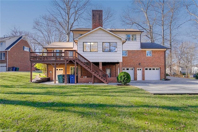 rear view of property featuring driveway, a lawn, a chimney, stairway, and brick siding