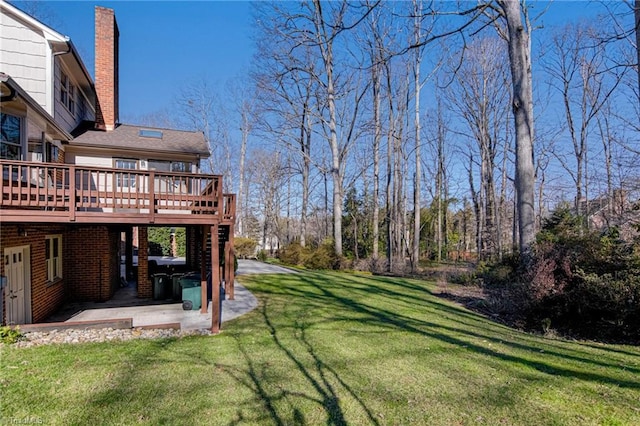 view of yard with a wooden deck