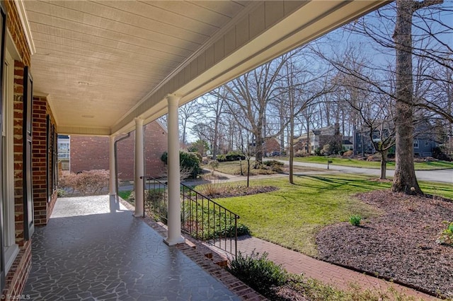 view of patio / terrace with a residential view and covered porch