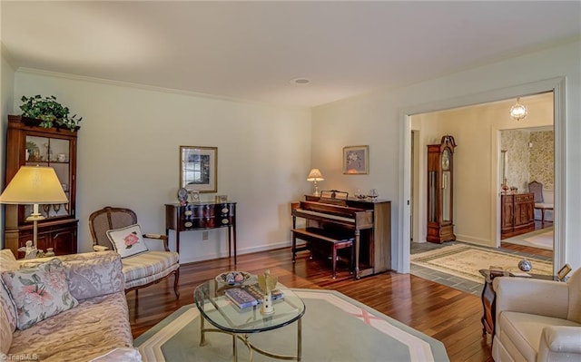 living room featuring baseboards and wood finished floors