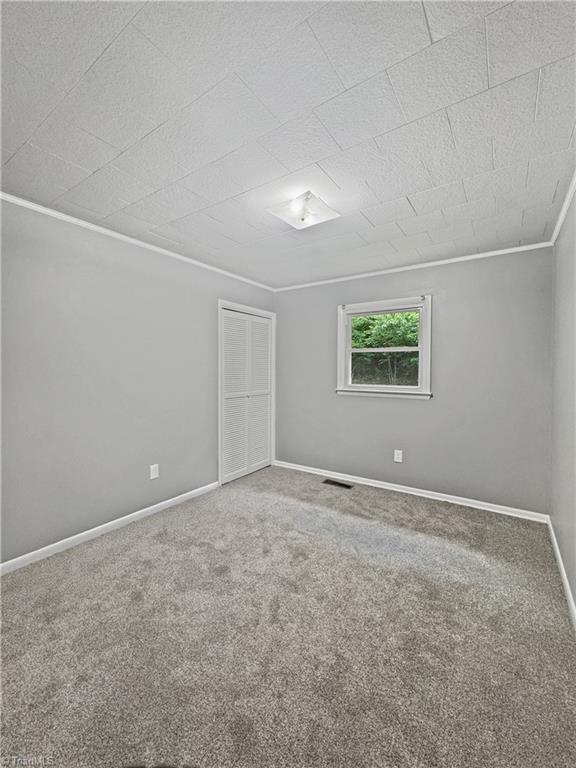 964 Mountain View Rd, North Wilkesboro, NC 28659 - spare room featuring carpet and baseboards