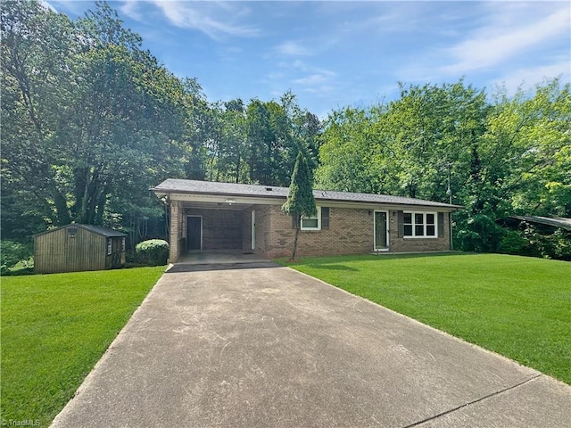 964 Mountain View Rd, North Wilkesboro, NC 28659 - view of front of house with driveway, a shed, an outbuilding, a front yard, and brick siding