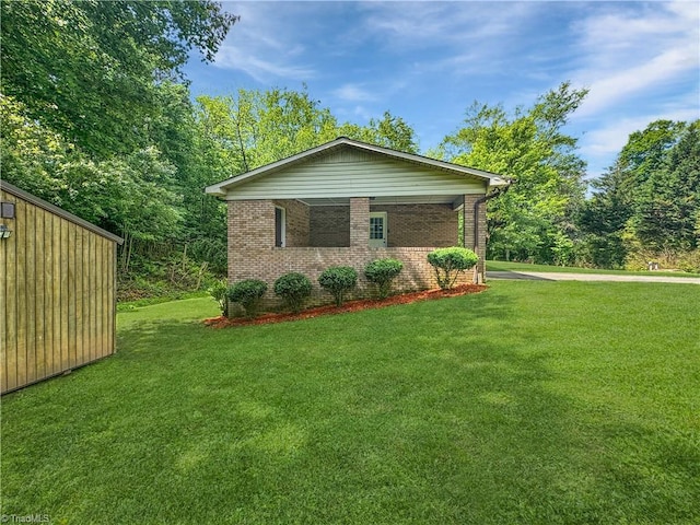 964 Mountain View Rd, North Wilkesboro, NC 28659 - view of property exterior featuring brick siding and a yard