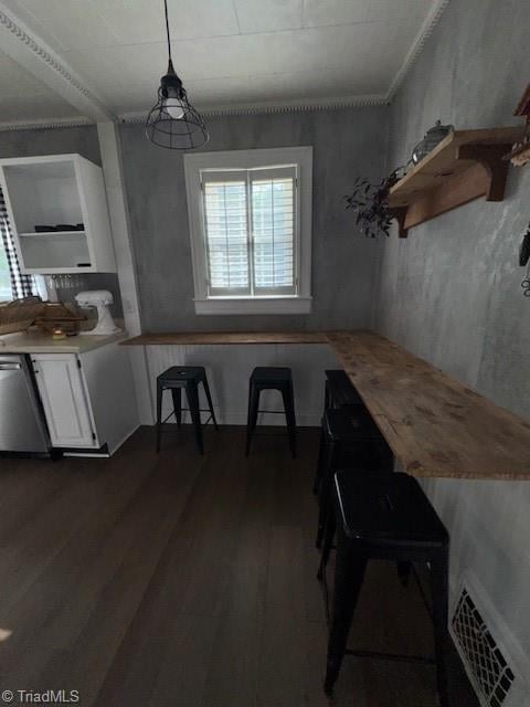 dining area featuring visible vents and dark wood-style floors