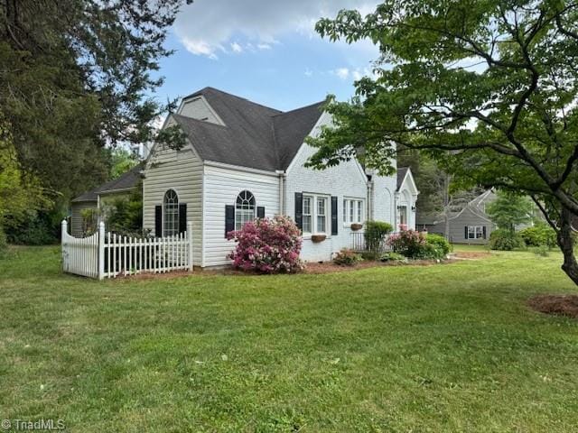 view of home's exterior featuring a lawn