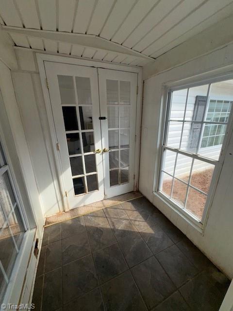 unfurnished sunroom featuring french doors