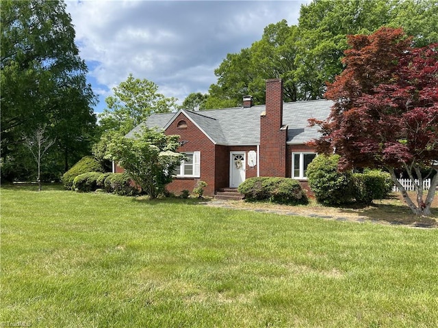 1716 US Highway 220, Stokesdale, NC 27357 - view of front of home featuring a front lawn, a chimney, and brick siding
