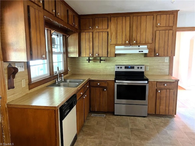 1716 US Highway 220, Stokesdale, NC 27357 - kitchen with stainless steel range with electric stovetop, under cabinet range hood, white dishwasher, a sink, and backsplash