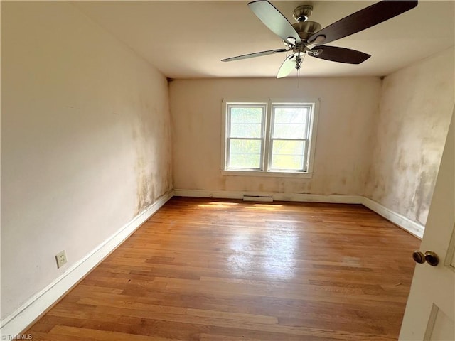 1716 US Highway 220, Stokesdale, NC 27357 - unfurnished room with wood finished floors, baseboards, and a ceiling fan