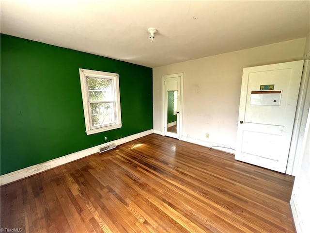 1716 US Highway 220, Stokesdale, NC 27357 - empty room with baseboards and wood finished floors