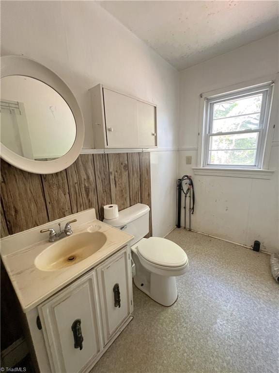1716 US Highway 220, Stokesdale, NC 27357 - bathroom with vanity, toilet, and wainscoting