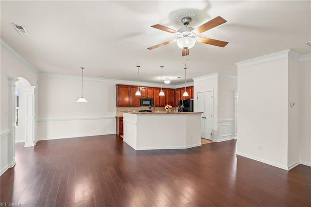 kitchen with dark hardwood / wood-style floors, black appliances, a center island, crown molding, and decorative light fixtures