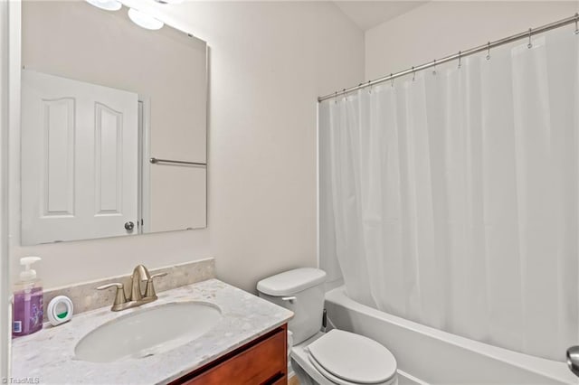 full bathroom with vanity, toilet, and shower / tub combo