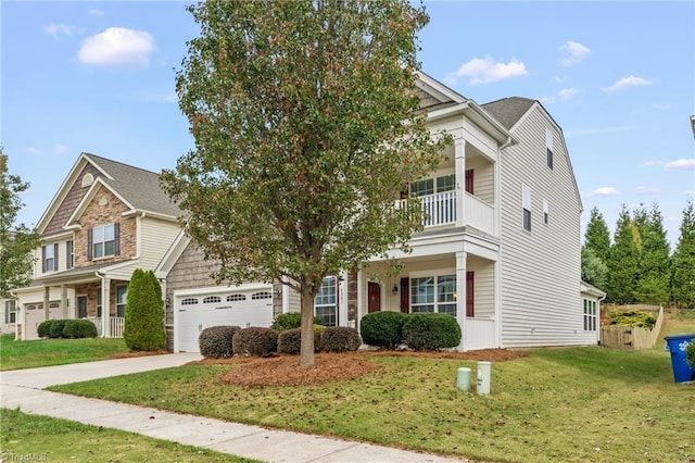 4887 Old Towne Village Cir, Pfafftown, NC 27040 - view of front of home with fence, concrete driveway, a front lawn, and a balcony