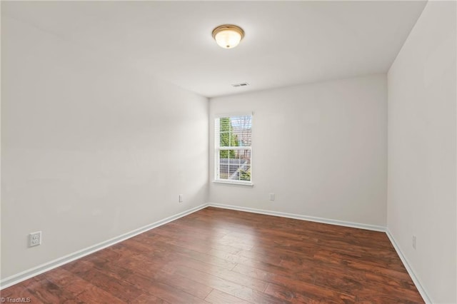 empty room featuring dark hardwood / wood-style floors