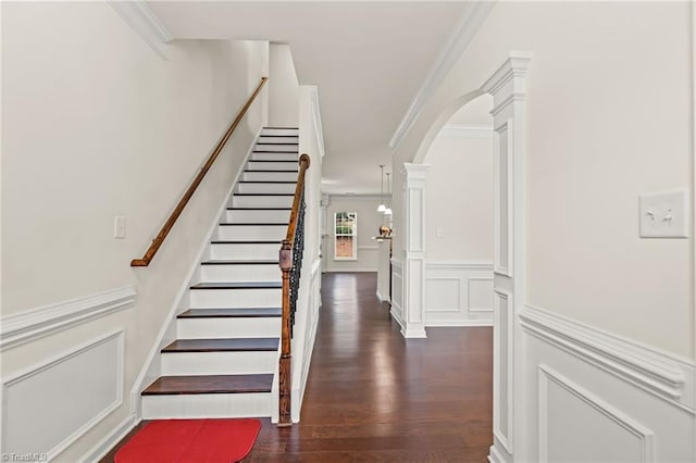 4887 Old Towne Village Cir, Pfafftown, NC 27040 - stairs featuring crown molding, arched walkways, and wood finished floors