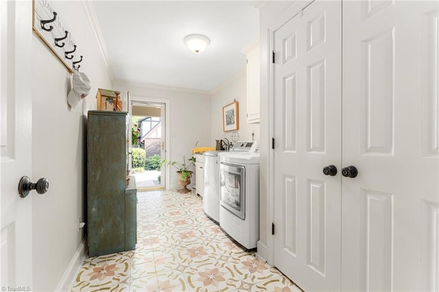 5001 Edinborough Rd, Greensboro, NC 27406 - clothes washing area with light tile patterned floors, crown molding, baseboards, washer and clothes dryer, and cabinet space