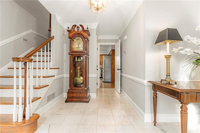 5001 Edinborough Rd, Greensboro, NC 27406 - foyer with visible vents, baseboards, crown molding, and stairs
