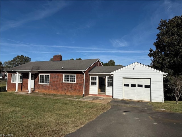 ranch-style house with a garage and a front yard