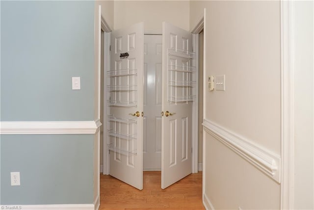 hallway with light wood finished floors