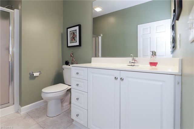 bathroom with vanity, toilet, and a shower stall