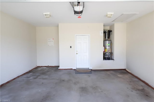 garage featuring gas water heater, a garage door opener, and baseboards