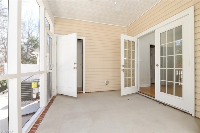 unfurnished sunroom featuring french doors