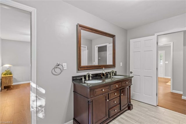 bathroom featuring vanity and wood-type flooring