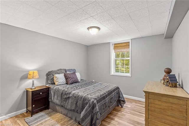 bedroom with light wood-type flooring