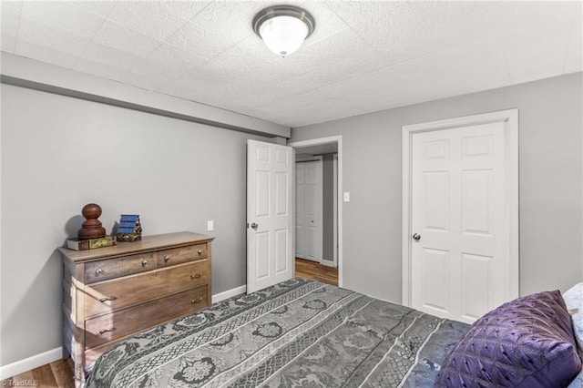 bedroom with wood-type flooring