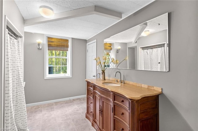 bathroom with vanity and tile patterned flooring