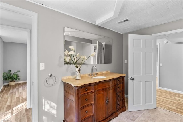 bathroom featuring vanity and hardwood / wood-style flooring