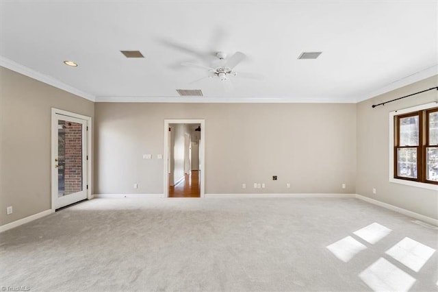 carpeted empty room with ceiling fan and ornamental molding