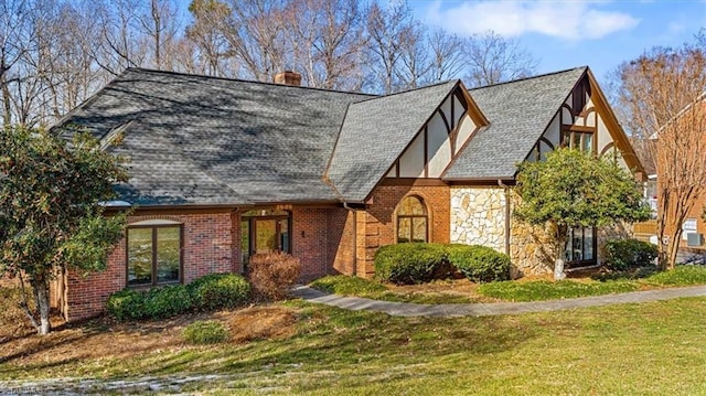 tudor house with a front yard