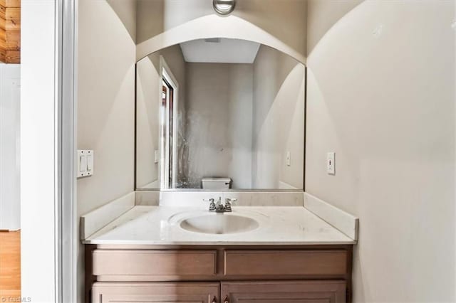 bathroom with toilet and vanity