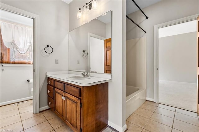 full bathroom with toilet, tile patterned flooring, bathing tub / shower combination, and vanity