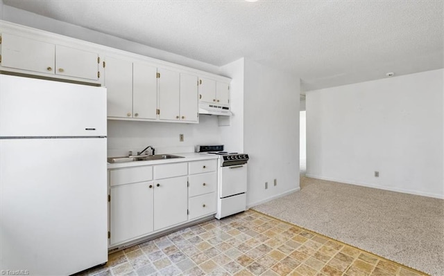 kitchen featuring white appliances, white cabinets, a textured ceiling, light carpet, and sink