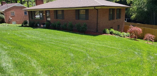 904 Fiske St, Durham, NC 27703 - view of front of property featuring a chimney, brick siding, and a shingled roof