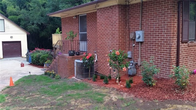 904 Fiske St, Durham, NC 27703 - view of side of home featuring brick siding and driveway