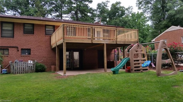 904 Fiske St, Durham, NC 27703 - rear view of property with a lawn, a playground, and a patio area