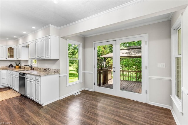 1556 Jubilee Trl, Kernersville, NC 27284 - kitchen featuring stainless steel dishwasher, light stone counters, white cabinets, dark wood-style flooring, and glass insert cabinets
