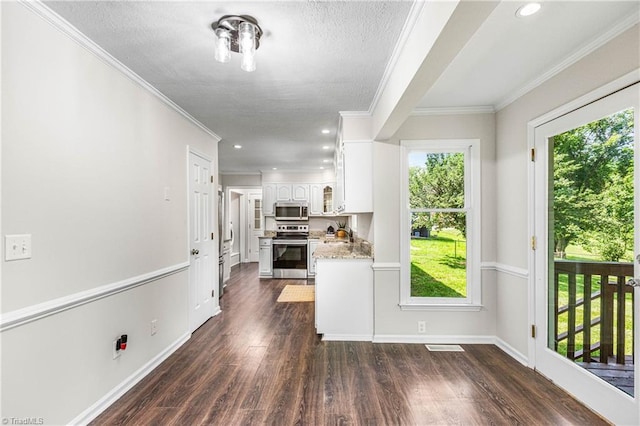 1556 Jubilee Trl, Kernersville, NC 27284 - kitchen featuring stainless steel appliances, ornamental molding, white cabinetry, dark wood-style floors, and a textured ceiling