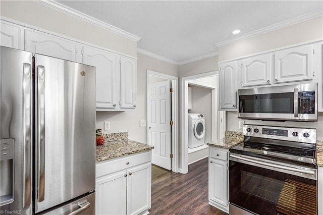 1556 Jubilee Trl, Kernersville, NC 27284 - kitchen with appliances with stainless steel finishes, washer / clothes dryer, white cabinets, light stone counters, and ornamental molding