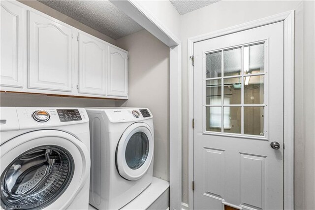 1556 Jubilee Trl, Kernersville, NC 27284 - laundry area with washer and dryer, cabinet space, and a textured ceiling