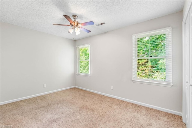 1556 Jubilee Trl, Kernersville, NC 27284 - empty room featuring carpet flooring, a ceiling fan, and a textured ceiling