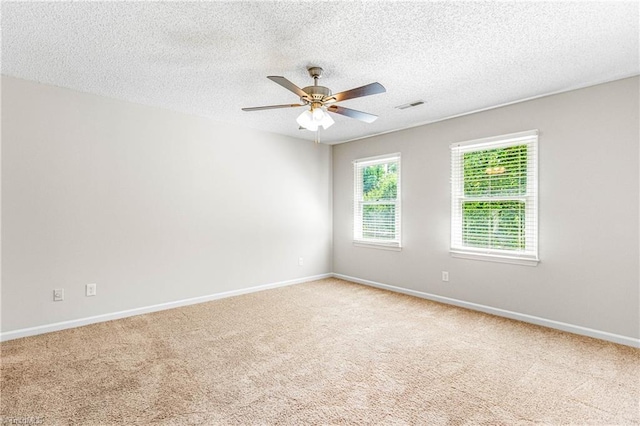 1556 Jubilee Trl, Kernersville, NC 27284 - spare room with ceiling fan, light carpet, and a textured ceiling