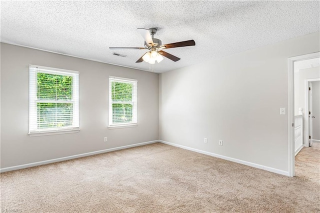 1556 Jubilee Trl, Kernersville, NC 27284 - carpeted spare room with a ceiling fan and a textured ceiling