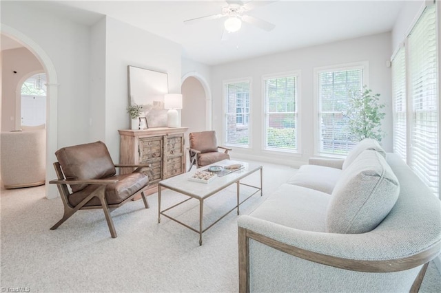 2809 Churchill Ct, High Point, NC 27262 - carpeted living area featuring arched walkways and ceiling fan