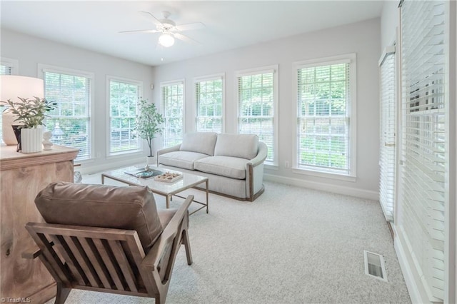 2809 Churchill Ct, High Point, NC 27262 - carpeted living area with plenty of natural light, a ceiling fan, and baseboards